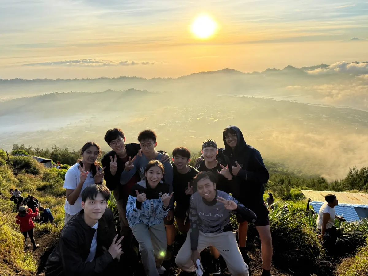 At the summit of Mount Batur at sunrise with the rest of the group