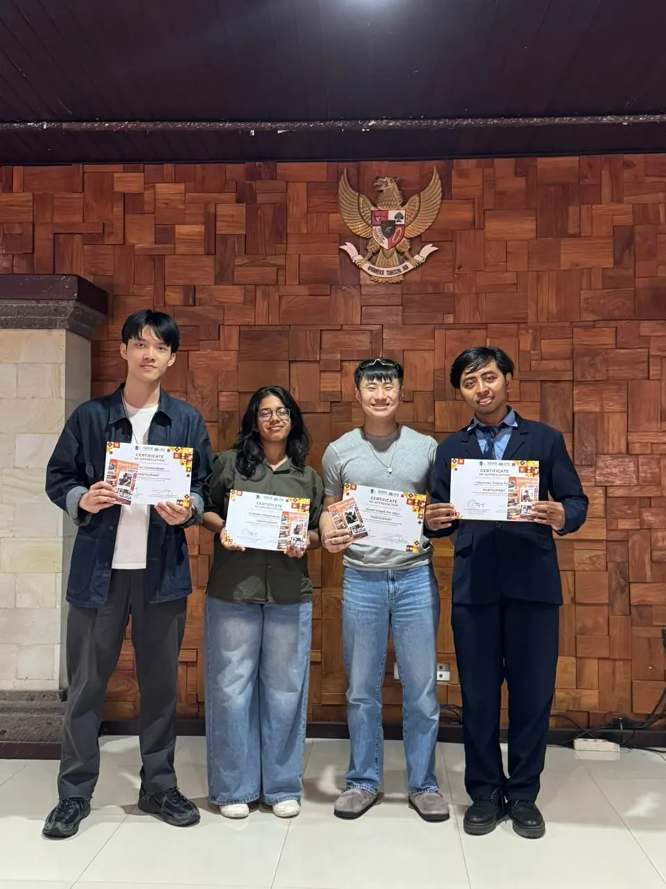 The team on stage at the close of the programme, holding their certificates