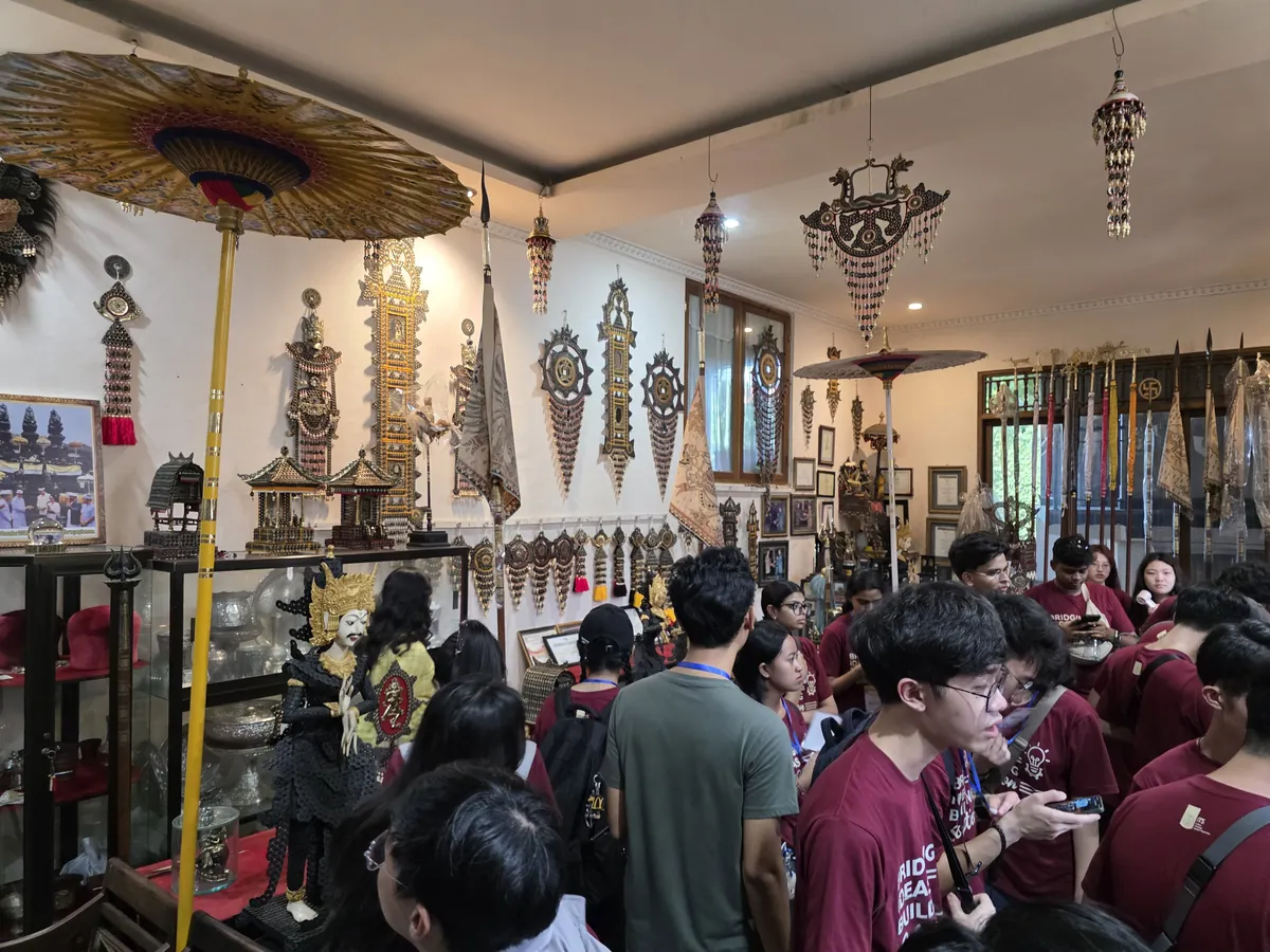The cohort inside a workshop of Balinese ceremonial craft during an industry visit