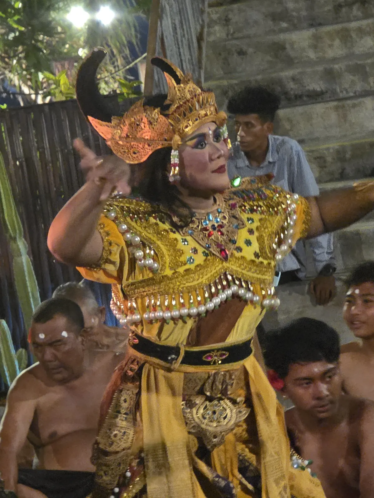 Balinese dancer in full traditional costume performing