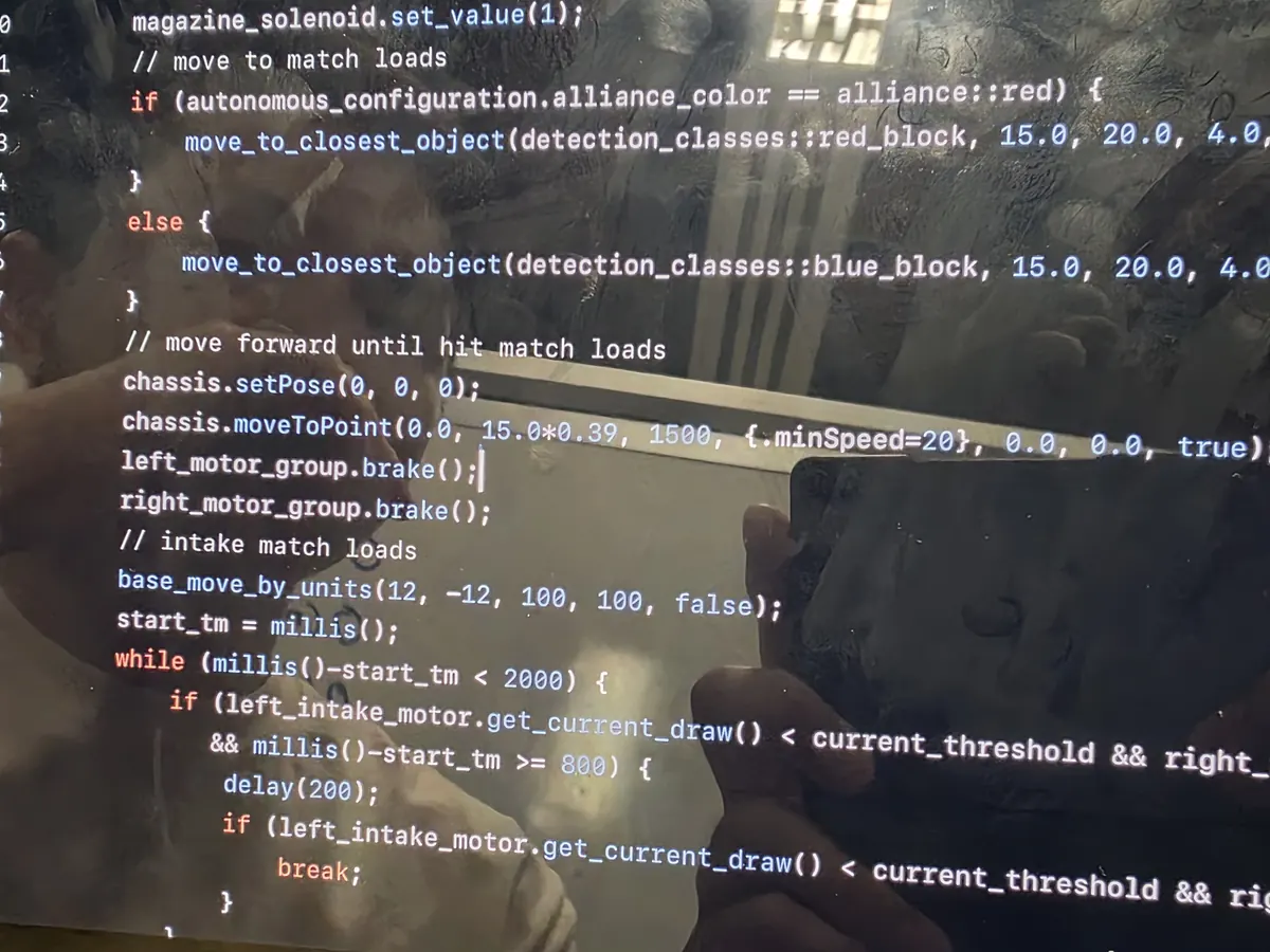 Autonomous routine source code on screen, branching on alliance colour and reading intake motor current draw