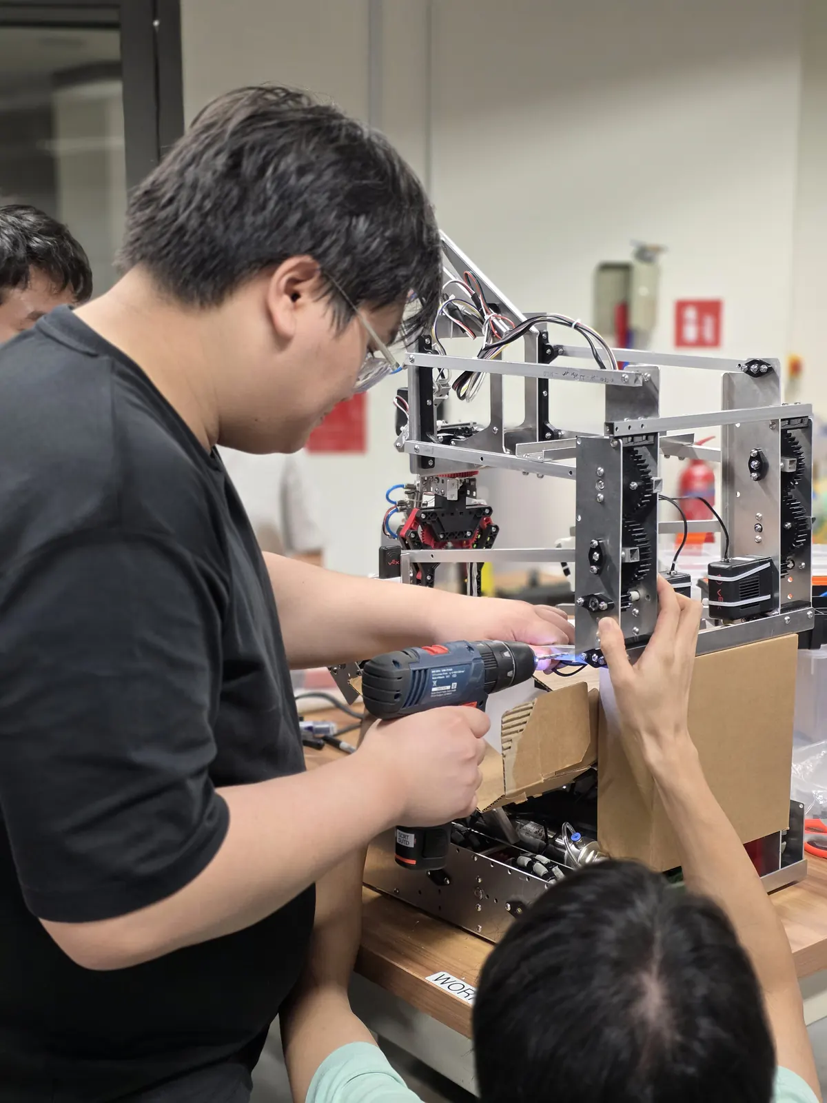 Assembling the robot by hand with a power drill
